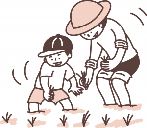 田植えをする親子